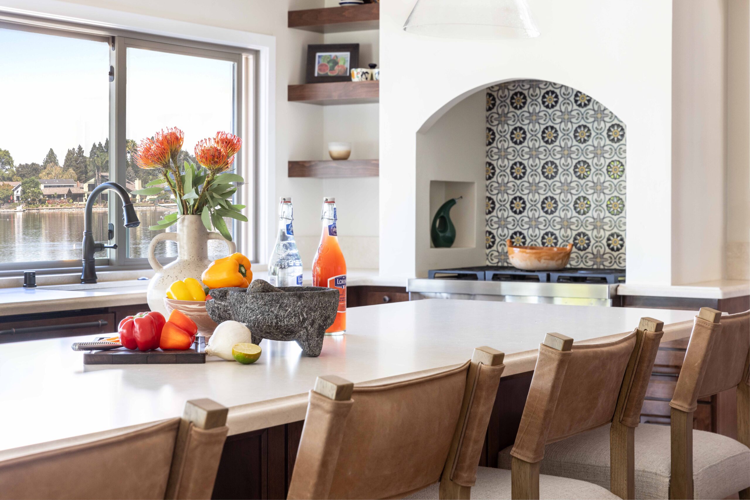 Spanish style kitchen with accent tile behind the range.